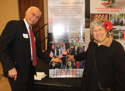 Jose Feliciano and Sister Alicia Alvarado point to a photo of Judge Villanueva's induction