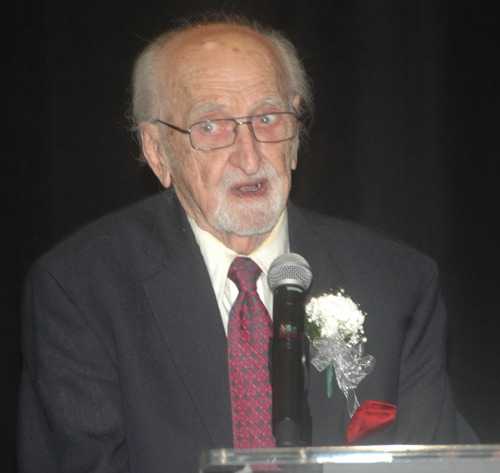 Hungarian community leader Ernie Mihaly inducts architect Richard Fleischman into the Cleveland International Hall of Fame. 