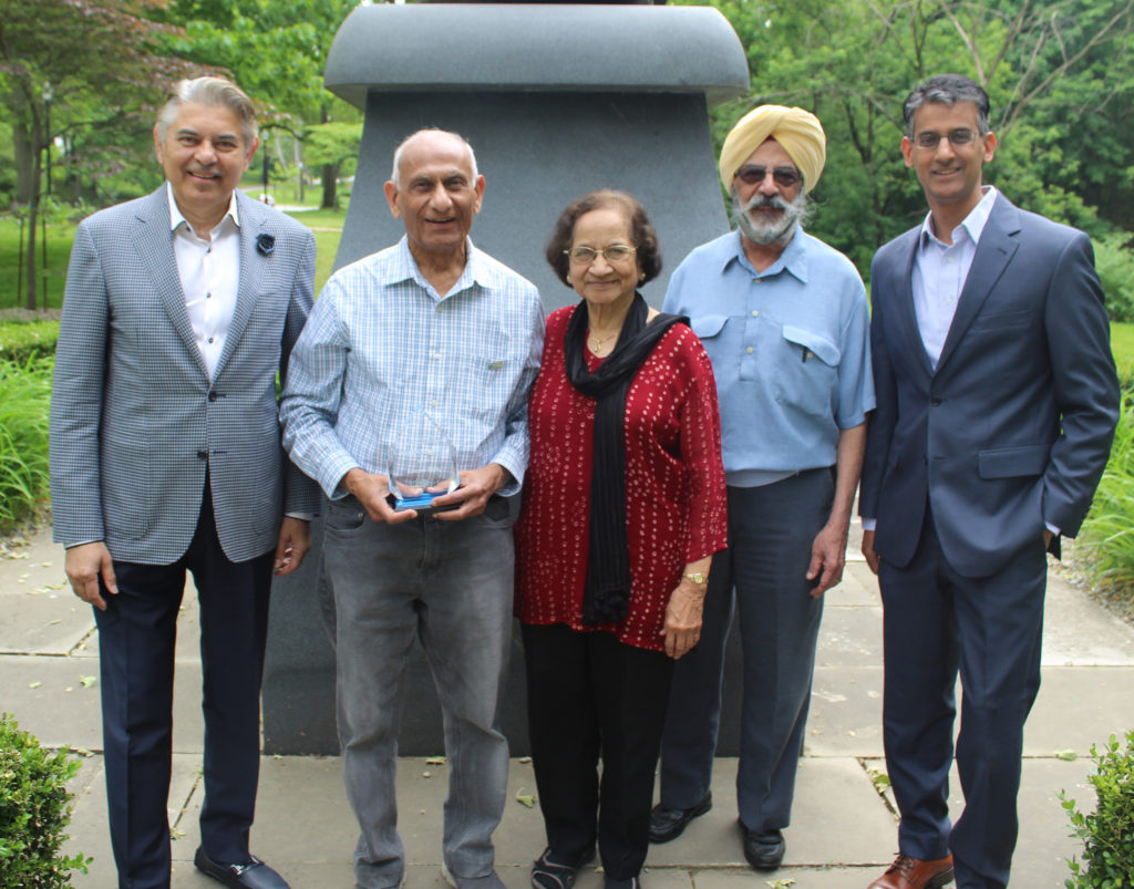 Sudarshan Sathe, Ramesh Shah, Jaya Shah, Paramjit Singh and Baiju Shah in front of the Gandhi statue in the India Cultural Garden