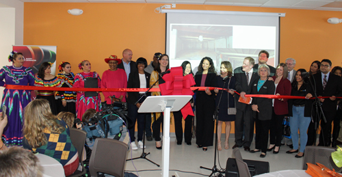 Veronica Dahlberg cuts the ribbon at the new HOLA Center